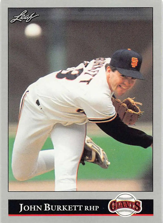 San Francisco Giants pitcher John Burkett mid-delivery in white home uniform