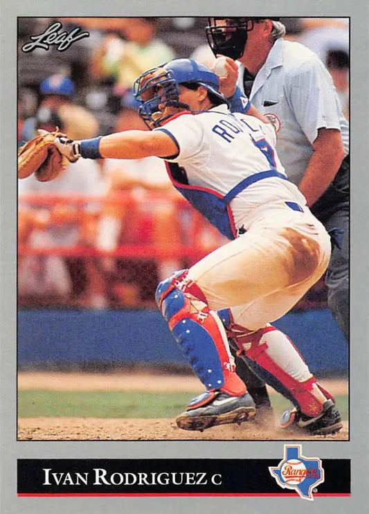 Baseball catcher Ivan Rodriguez in crouching position wearing Texas Rangers gear