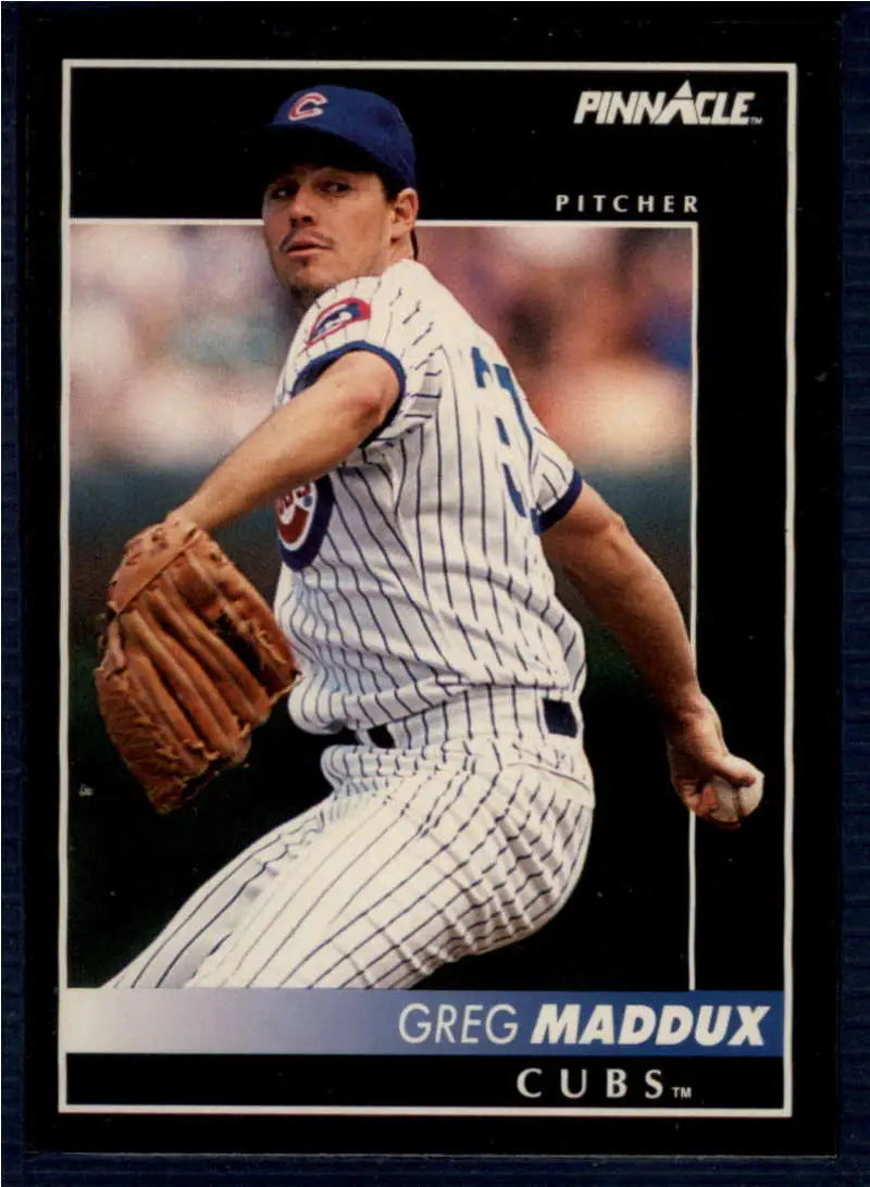 Baseball card of Greg Maddux, Chicago Cubs pitcher in pinstriped uniform mid-delivery