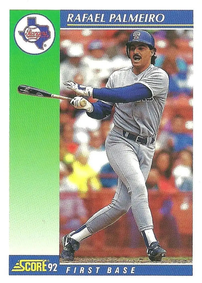 Baseball card of Rafael Palmeiro in Texas Rangers gray uniform mid-swing from 1992 Score set