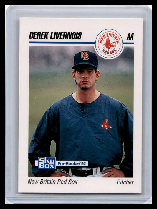 Baseball card of New Britain Red Sox pitcher in navy blue team jacket with logo