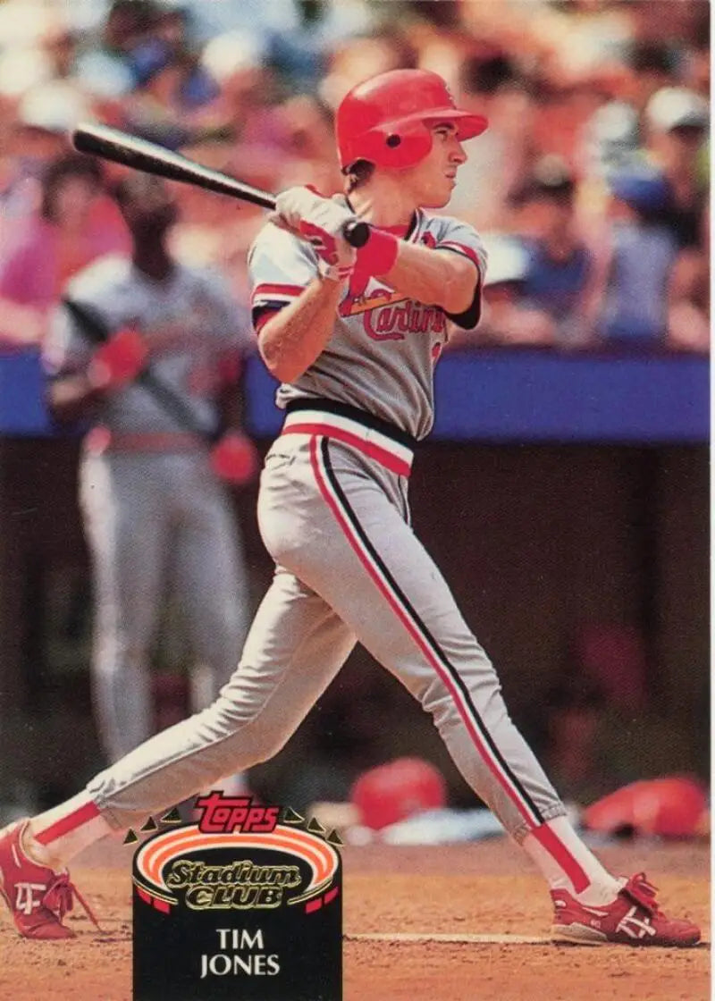 Baseball player in Cincinnati Reds uniform swinging bat for Tim Jones baseball card