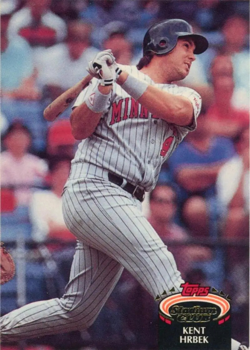 Kent Hrbek swinging a bat in Minnesota Twins pinstriped uniform on a Topps Stadium Club card