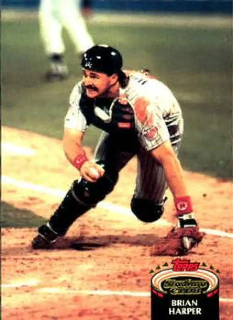 Baseball catcher Brian Harper crouching at home plate on 1992 Topps Stadium Club card