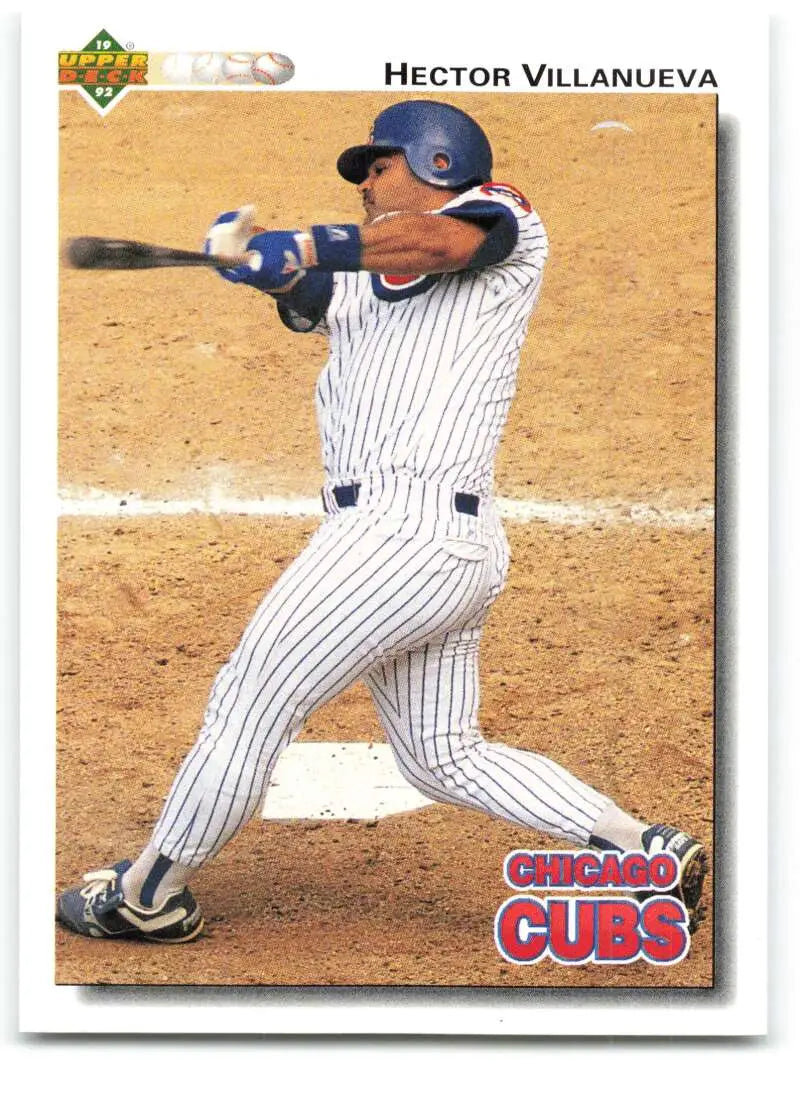 Hector Villanueva swinging bat in Chicago Cubs pinstripe uniform on baseball card