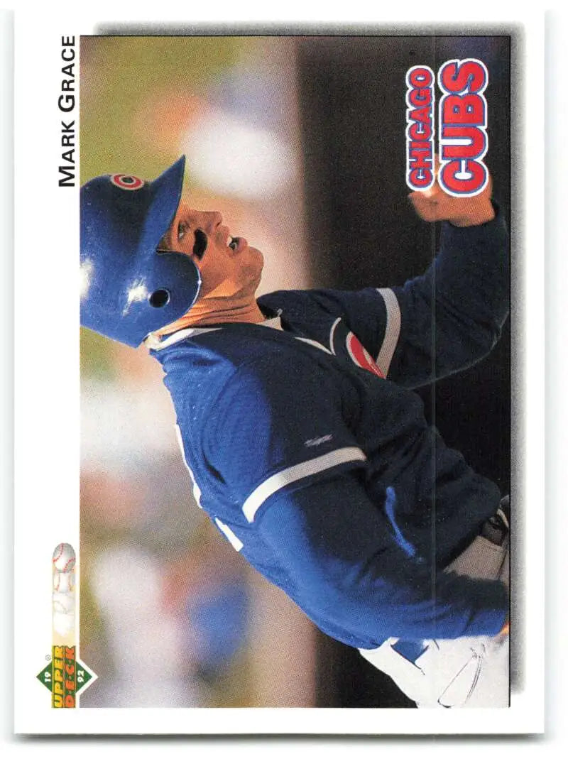 Baseball player in blue uniform swinging bat on Mark Grace Chicago Cubs baseball card