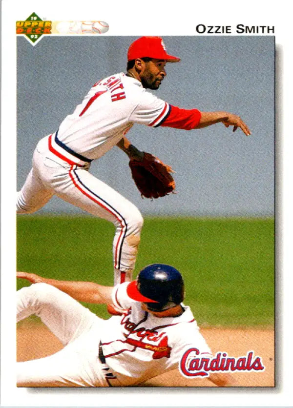 Ozzie Smith leaps over a baserunner on this St. Louis Cardinals baseball card