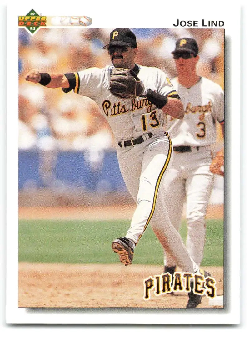 Jose Lind in a Pittsburgh Pirates uniform #13 throwing a ball for Upper Deck card