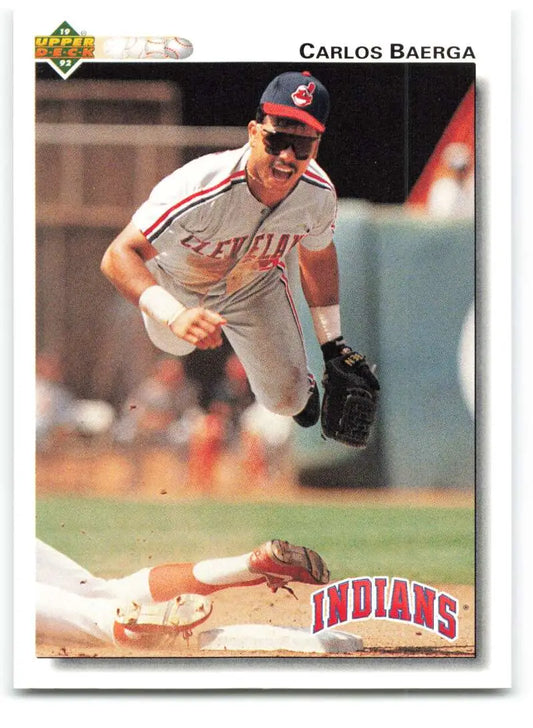 Cleveland Indians Carlos Baerga leaps over a baserunner on 1992 Upper Deck Baseball Card