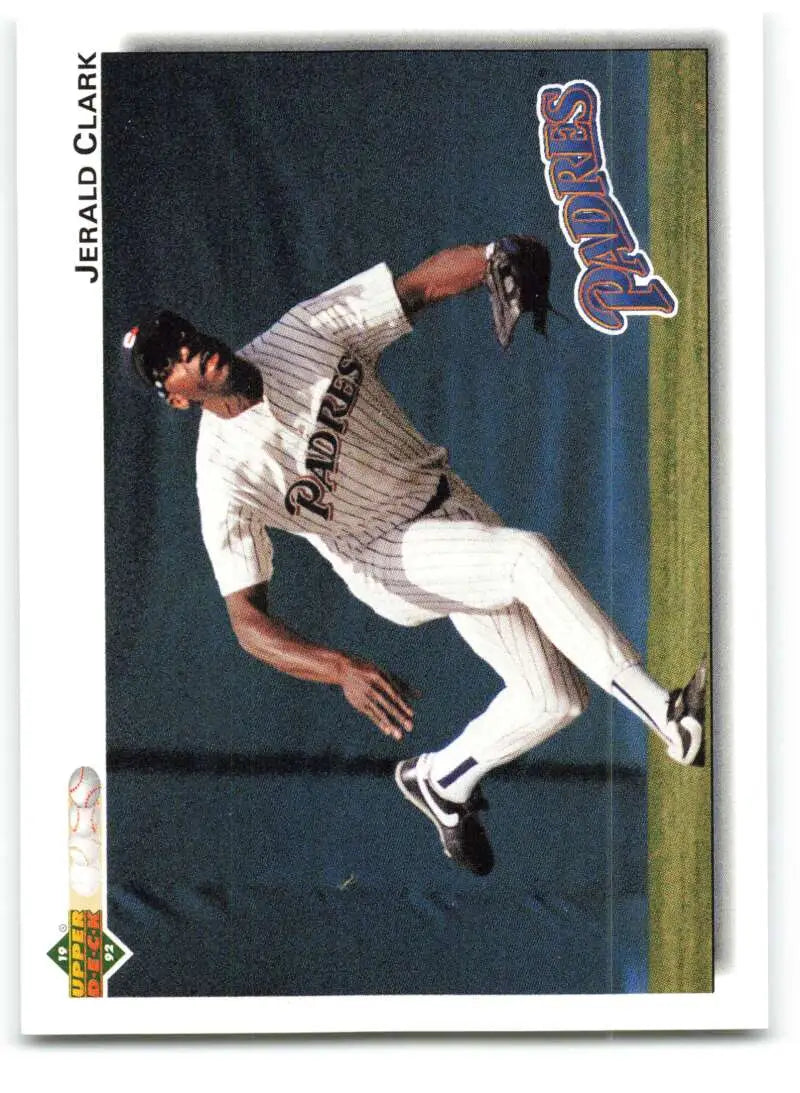 Baseball player Jerald Clark leaps for a catch in San Diego Padres pinstripes