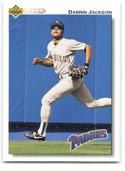 Baseball card of Darrin Jackson running in a white San Diego Padres uniform