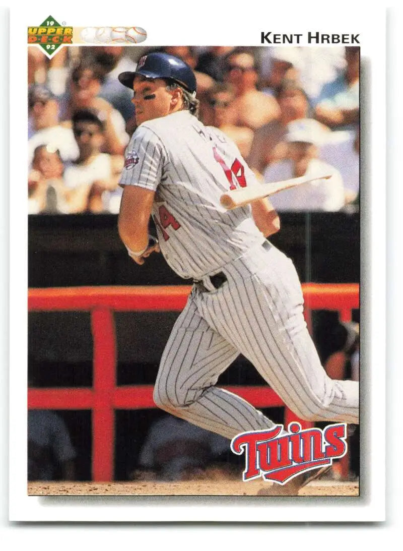 Minnesota Twins baseball card of Kent Hrbek in pinstriped uniform at bat