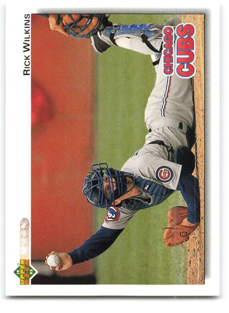 Baseball card featuring Chicago Cubs catcher Rick Wilkins in a crouching position