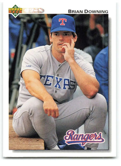 Brian Downing Texas Rangers baseball card in gray uniform sitting in dugout