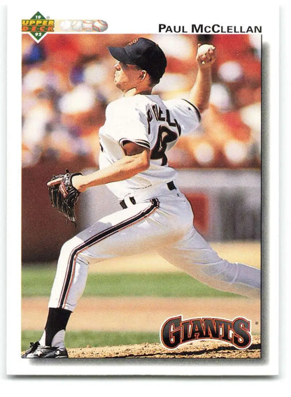 Baseball player Paul McClellan in San Francisco Giants uniform mid-pitch delivery