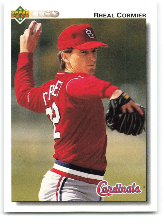 Baseball player Rheal Cormier in red St. Louis Cardinals uniform mid-pitching motion