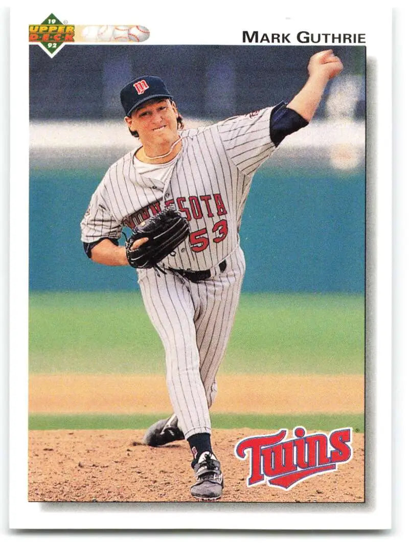 Baseball player Mark Guthrie in Minnesota Twins pinstriped uniform pitching