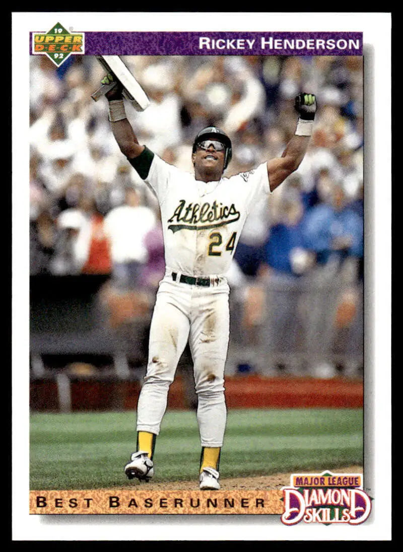 Rickey Henderson triumphantly celebrating on the field for Oakland Athletics baseball card