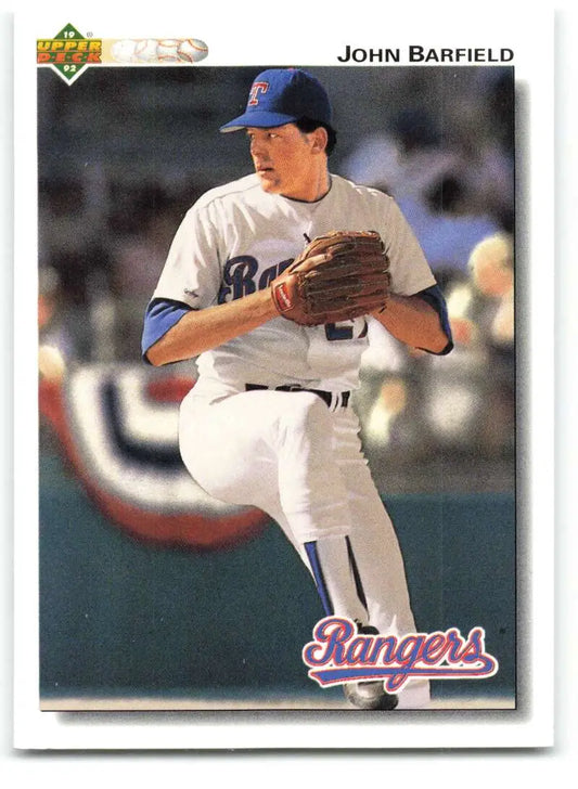 Texas Rangers baseball player John Barfield in pitching stance on 1992 card