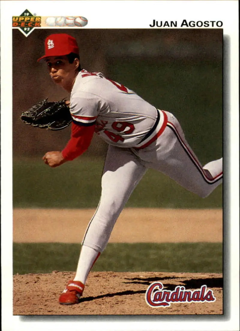 Baseball player Juan Agosto in white Cardinals uniform mid-pitch delivery for Upper Deck