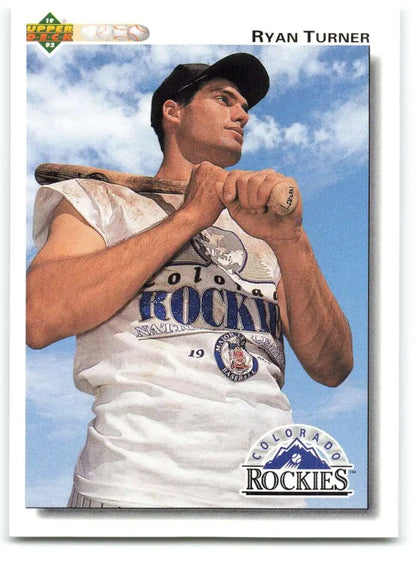 Baseball player Ryan Turner in Colorado Rockies uniform holding bat for baseball card