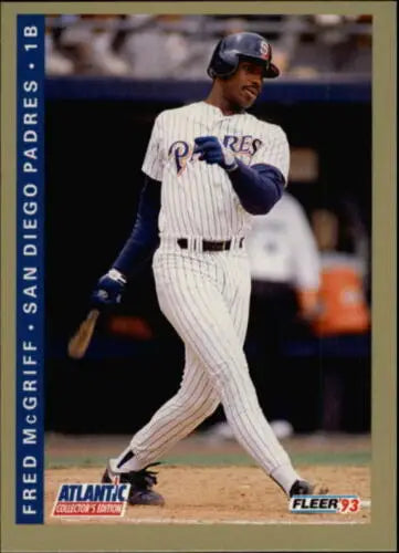 Baseball player Fred McGriff in San Diego Padres pinstriped uniform swinging bat