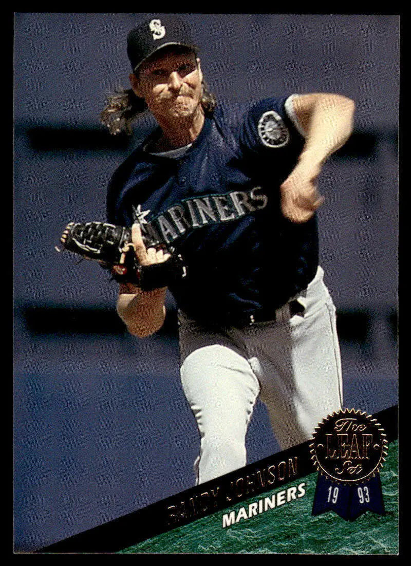 Randy Johnson mid-throw in navy uniform, Seattle Mariners Baseball Card 1993 Leaf #380