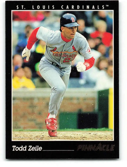 Todd Zeile of the St. Louis Cardinals in a gray uniform following through a swing