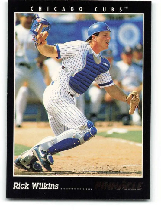 Rick Wilkins Chicago Cubs baseball card showing a catcher in pinstripe uniform at home plate