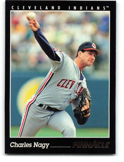 Cleveland Indians baseball card of Charles Nagy in mid-throwing motion in gray uniform