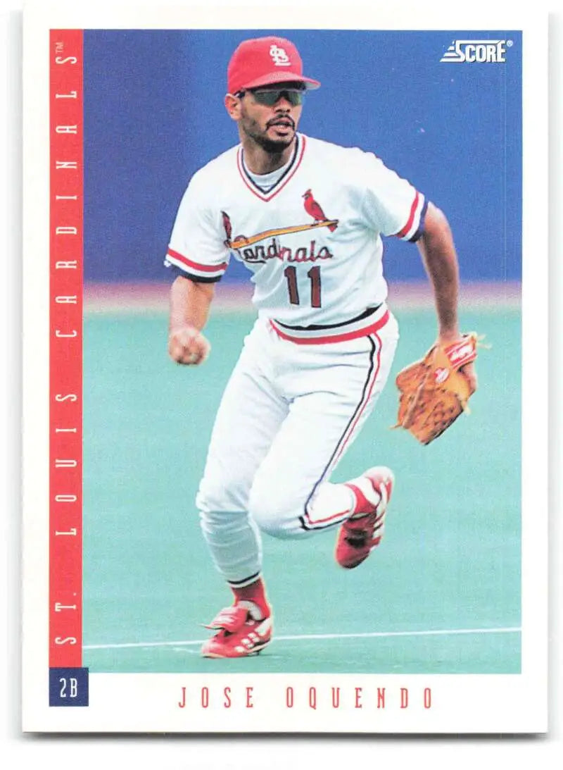 Jose Oquendo wearing number 11 in a white uniform on a St. Louis Cardinals baseball card