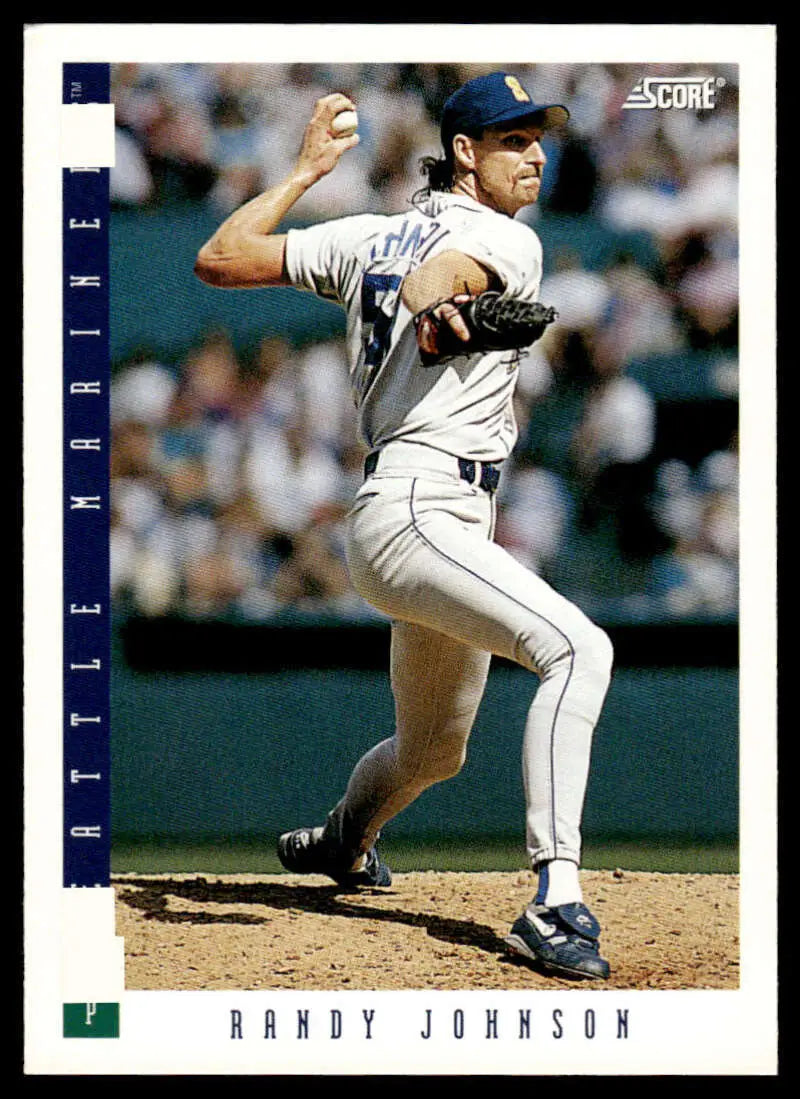 Randy Johnson mid-pitching in white uniform on Seattle Mariners baseball card