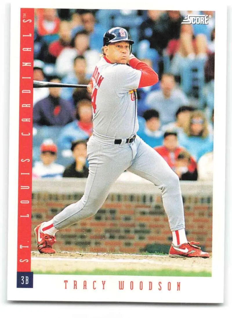 Baseball card of Tracy Woodson swinging bat for St. Louis Cardinals in white uniform