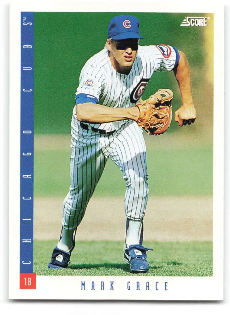 Chicago Cubs baseball card of Mark Grace in pinstriped home uniform fielding