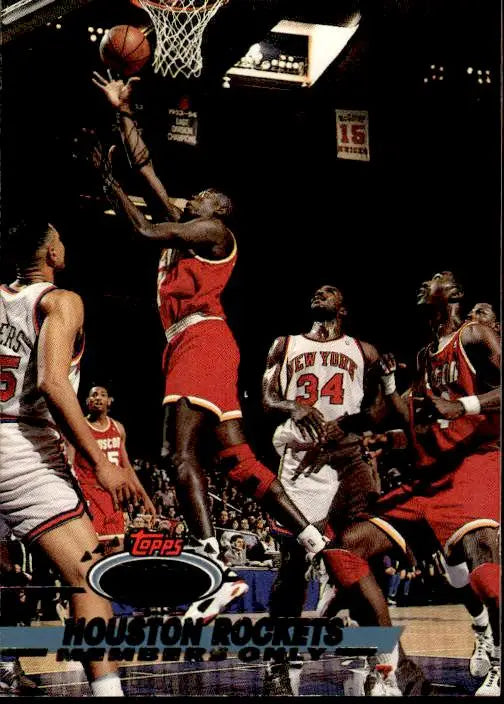 Basketball player in red jersey leaps for layup in 1993 Stadium Club Houston Rockets