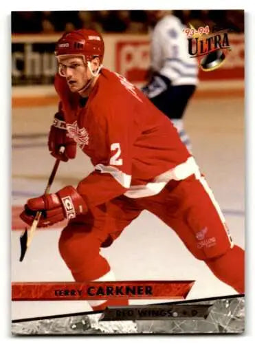 Hockey player in original gloss red Detroit Red Wings uniform Terry Carkner skating