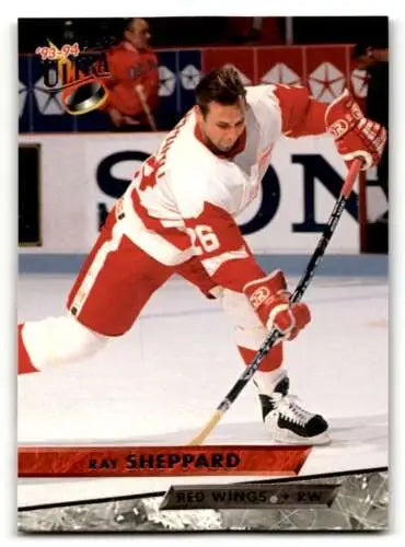 Hockey player in red and white Detroit Red Wings uniform taking a shot, Ray Sheppard Detroit