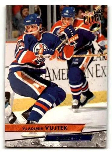 Hockey player in original gloss Edmonton Oilers uniform, Vladimir Vujtek skating on ice