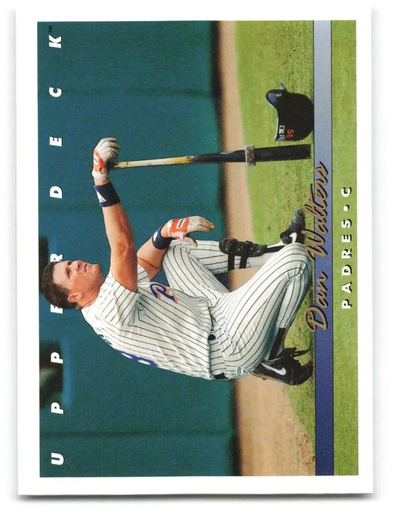 Baseball player in pinstripe uniform swinging bat on 1993 Upper Deck Dan Walters card