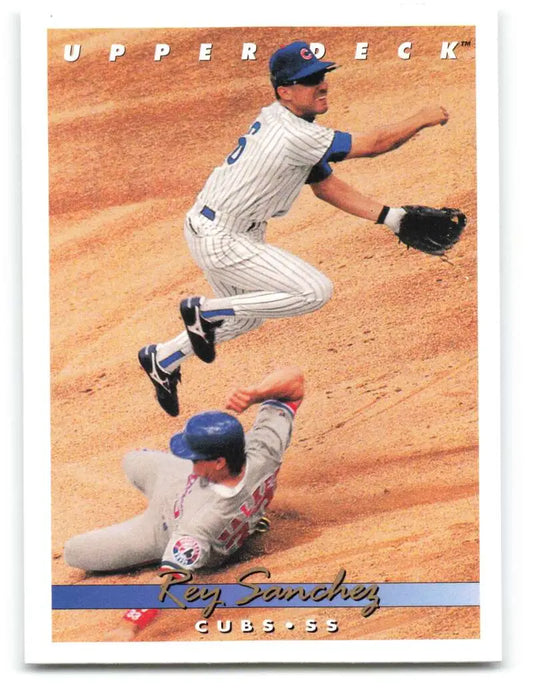 Rey Sanchez leaps over a sliding baserunner on a Chicago Cubs baseball card action shot