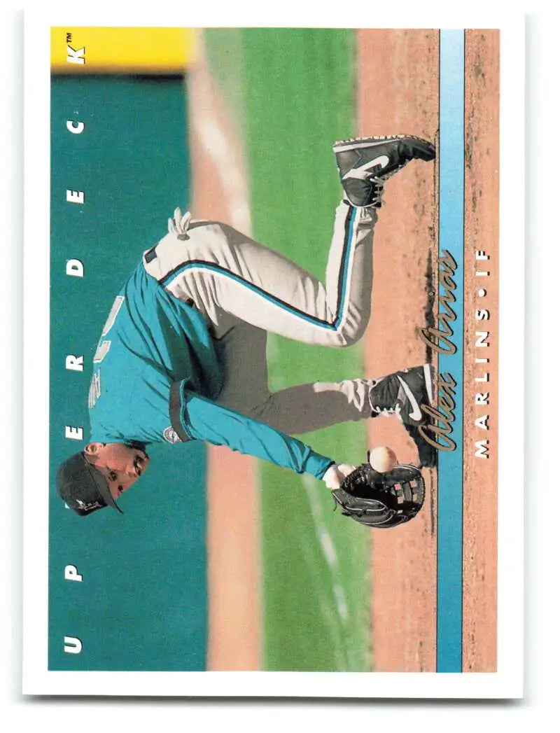 Baseball player in teal uniform stretching on field for Florida Marlins card featuring Alex Arias