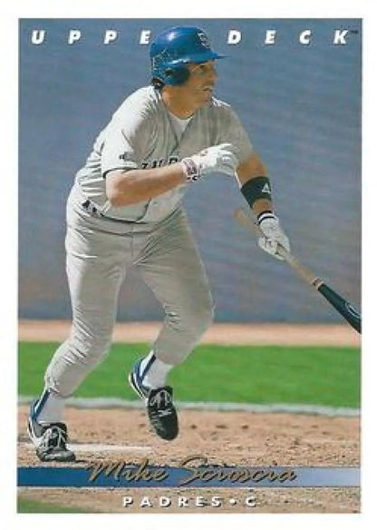 Baseball player in white Padres uniform swinging bat on 1993 Upper Deck Scioscia VG card