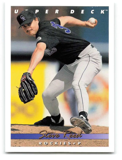 Steve Reed in black Colorado Rockies uniform mid-pitching on baseball card