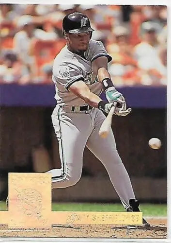 Baseball player in gray Florida Marlins uniform swinging bat in 1994 Donruss card