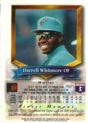 Baseball card of Darrell Whitmore in teal uniform reflecting original gloss look