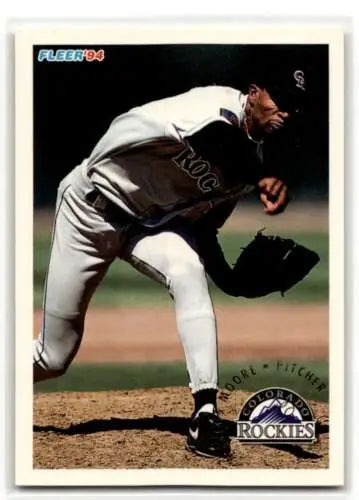 Baseball player Marcus Moore in Rockies uniform mid-pitch for U128 card original gloss