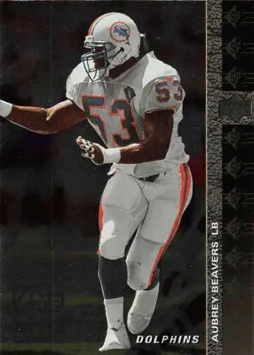 Football player in action showcasing original gloss of 1994 SP #40 Aubrey Beavers RC