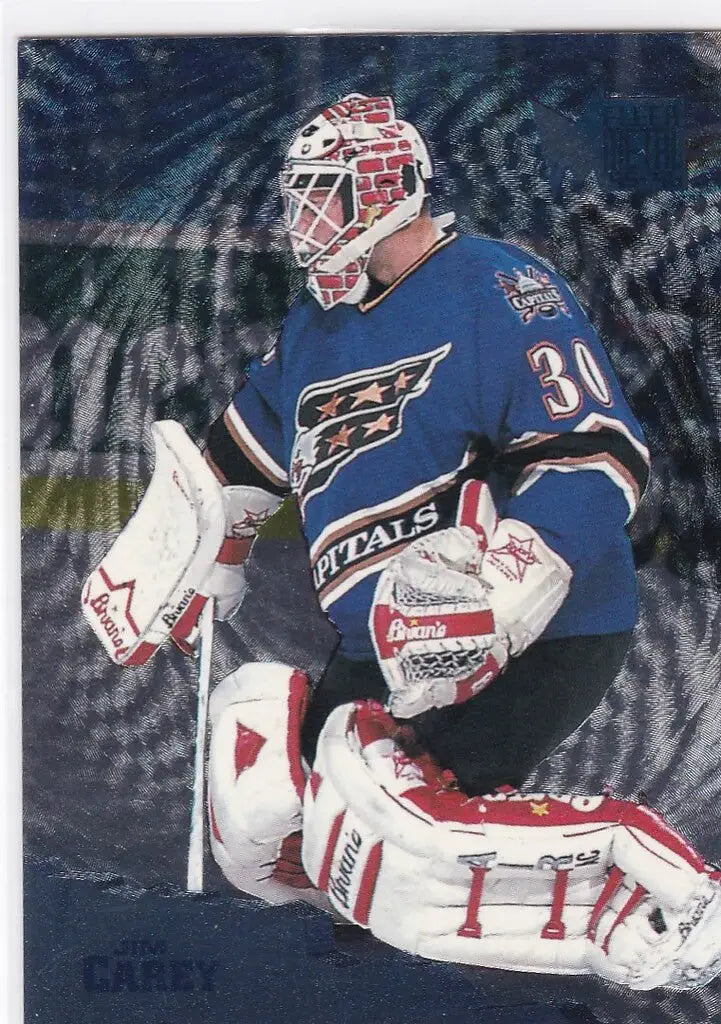 Ice hockey goaltender Jim Carey in blue jersey and pads for Fleer Metal Washington Capitals