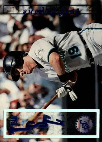 Baseball player Jeff Conine swinging bat in 1996 Stadium Club original gloss card