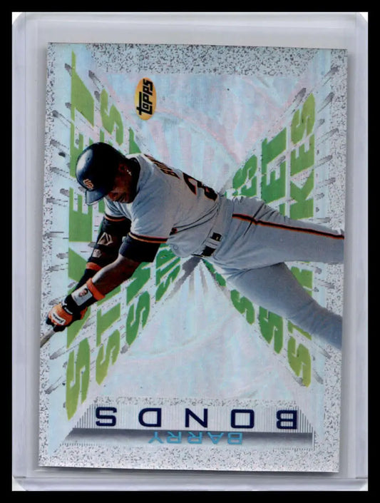 Baseball player in white uniform diving, featuring Barry Bonds of San Francisco Giants